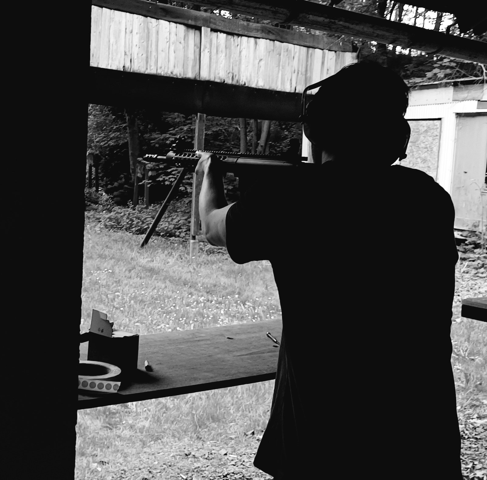 Photo of Roman Šeps at a gun range.